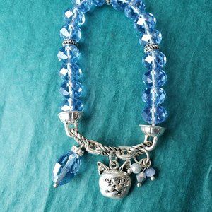 2/10$ Light blue bracelet with cat face